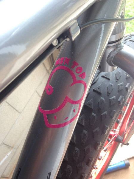 Original Mfn Top Vinyl Decal in Hot Pink on a bicycle